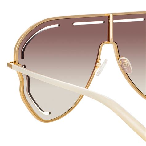 Gardenia Sunglasses in Gold .